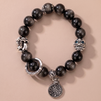 A deep-toned bracelet inspired by calmness, wisdom, and inner steadiness.