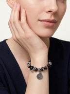 A deep-toned bracelet inspired by calmness, wisdom, and inner steadiness.